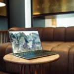 macbook pro on brown sofa