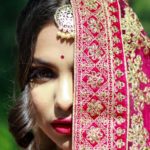 woman in red and white floral hijab