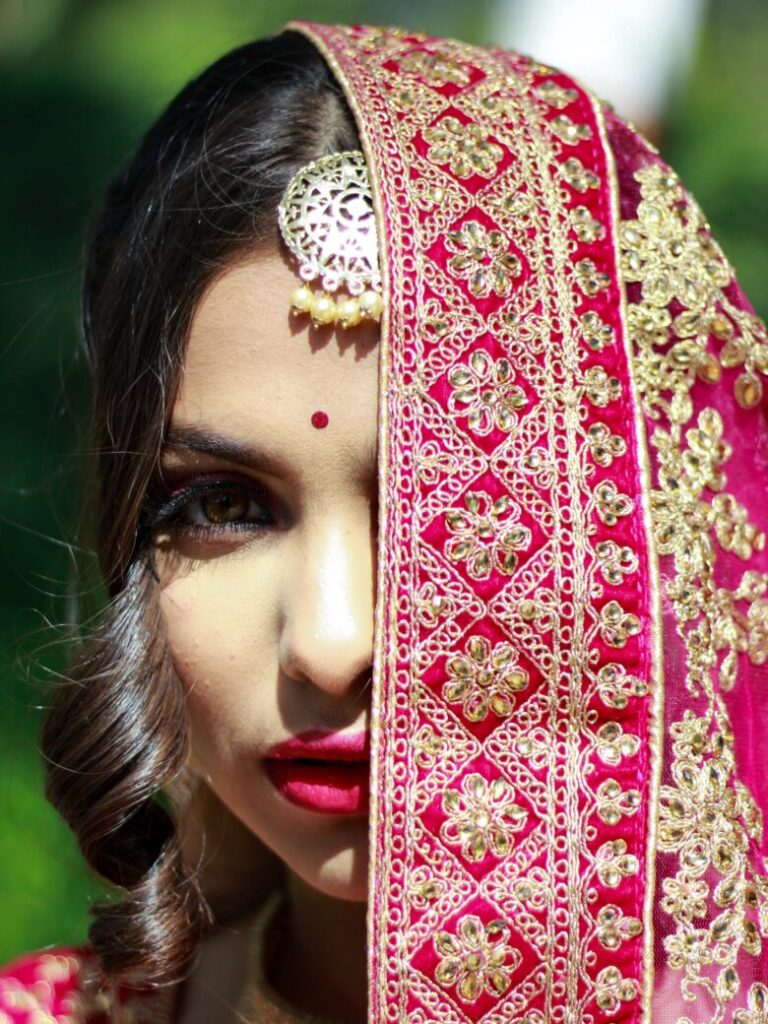 woman in red and white floral hijab